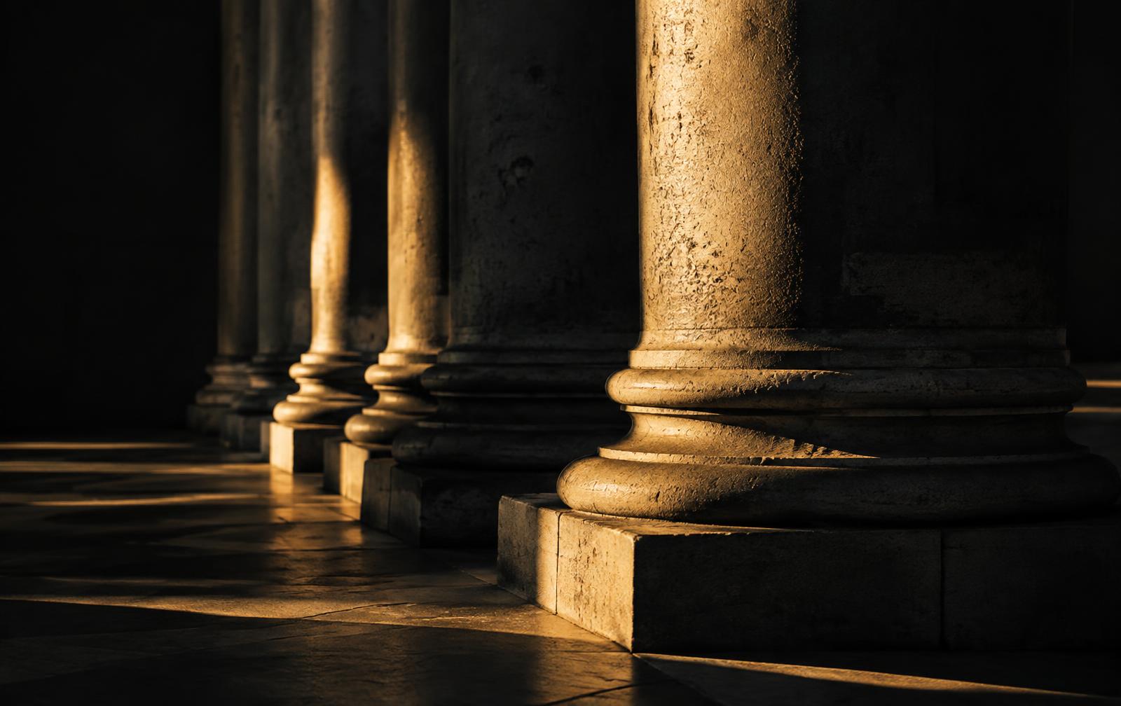 Classical stone columns in warm light
